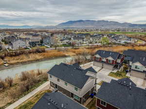 Aerial perspective of suburban area with a mountain backdrop