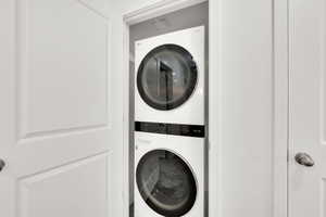 Laundry area with stacked washer / dryer