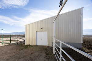 View of outbuilding featuring a mountain view