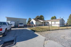 Single story home featuring a fenced front yard