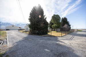 View of dirt / gravel driveway featuring a mountain view