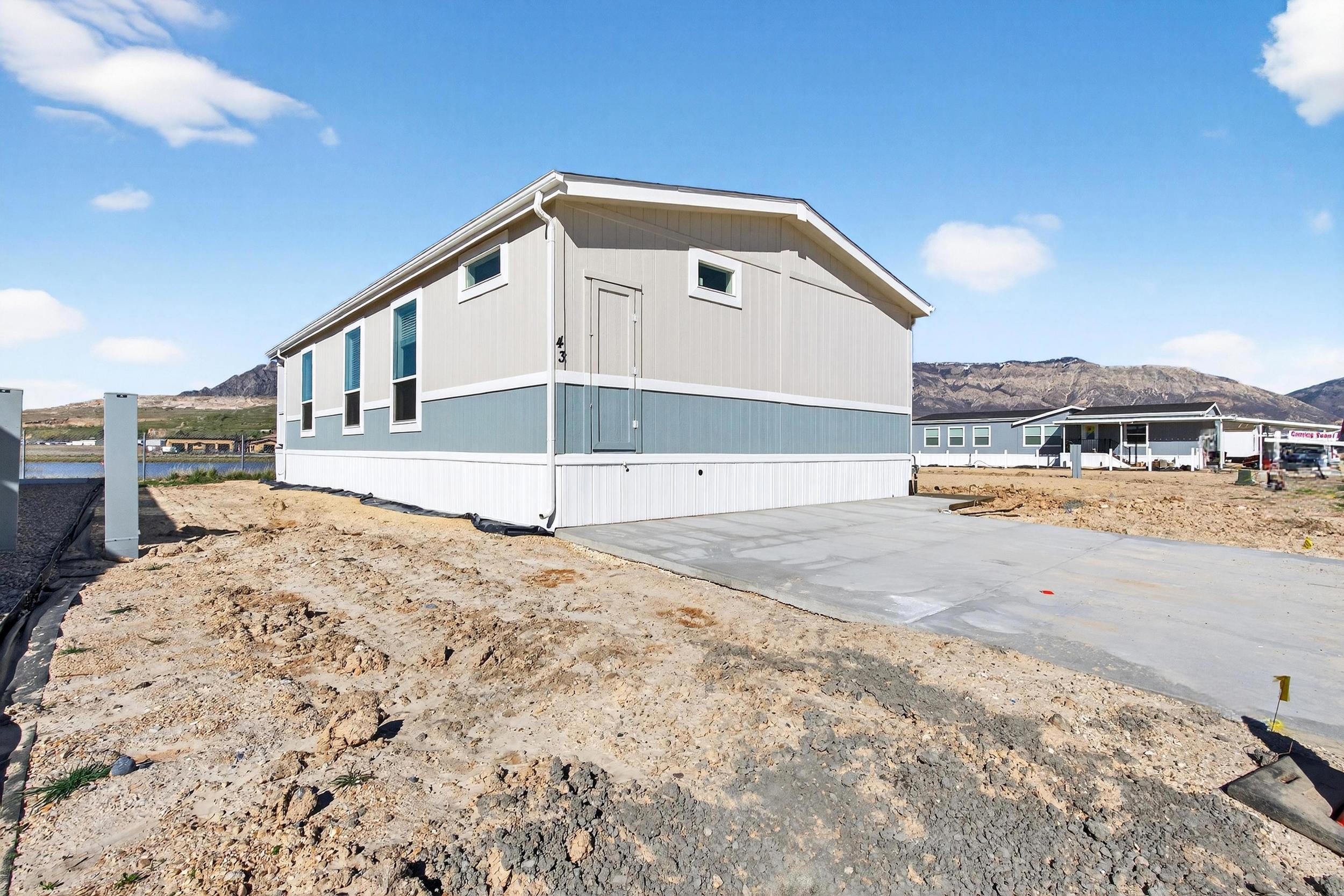 View of side of property with a mountain view