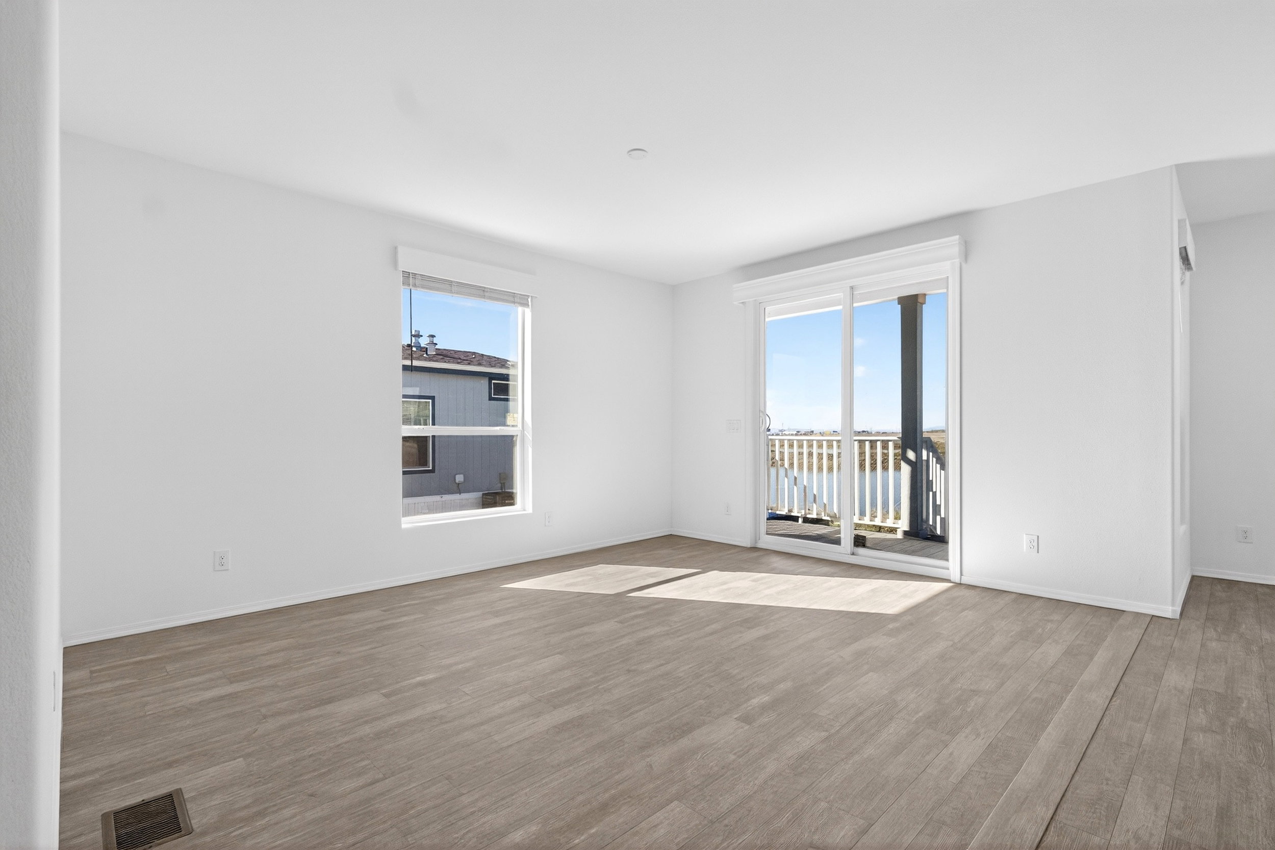 Empty room featuring wood finished floors and baseboards