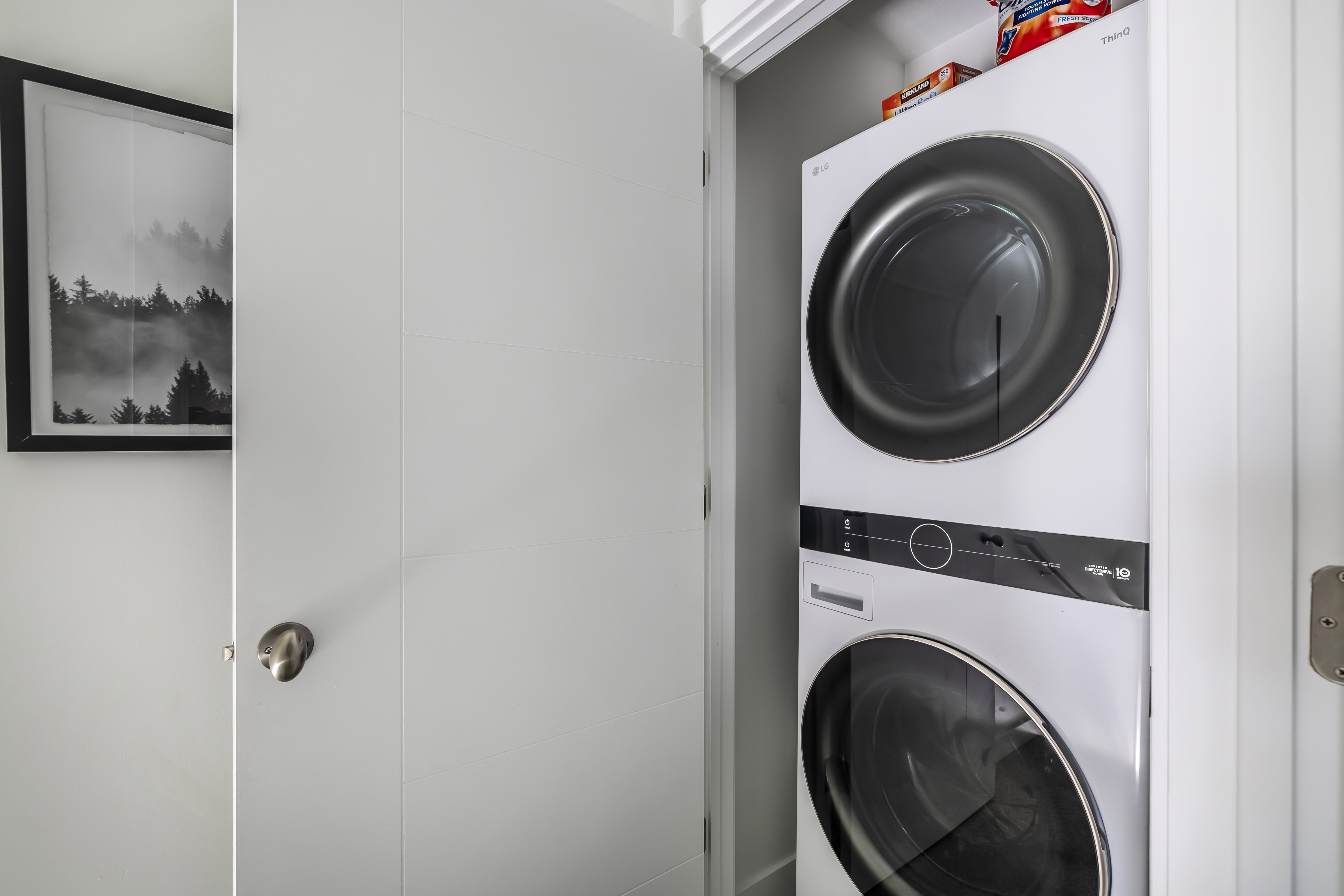 Laundry area with stacked washer / dryer
