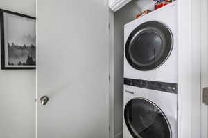 Laundry area with stacked washer / dryer