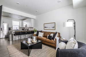 Living area with dark wood-style flooring