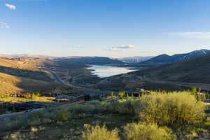 View of mountain backdrop with a nearby body of water