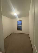 Unfurnished room with carpet floors