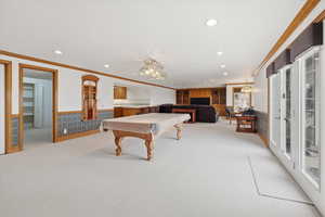 Game room featuring a wainscoted wall, light carpet, recessed lighting, crown molding, and billiards table
