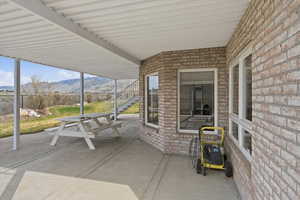 View of patio featuring a mountain view and stairs
