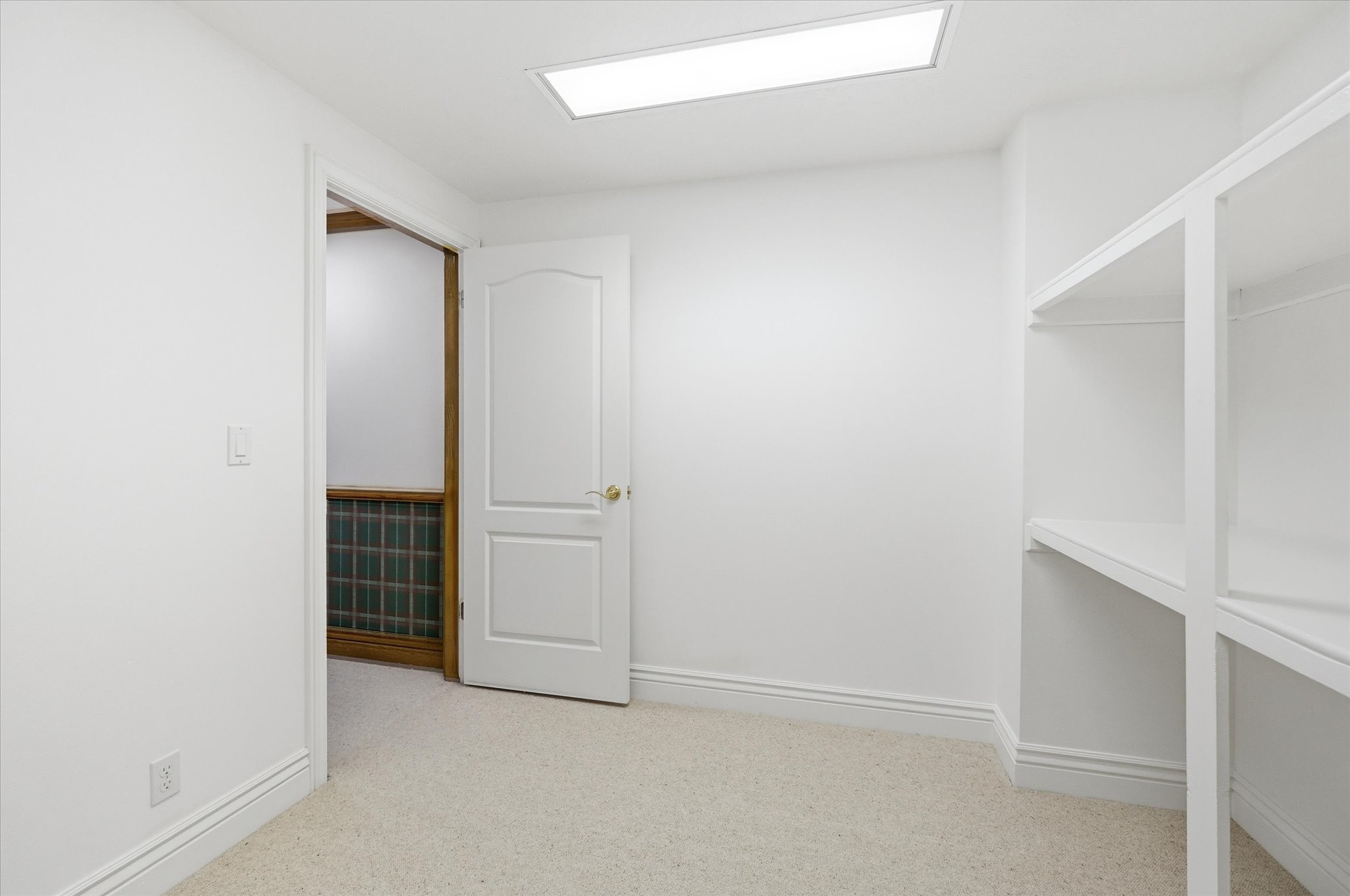 Interior space featuring light carpet