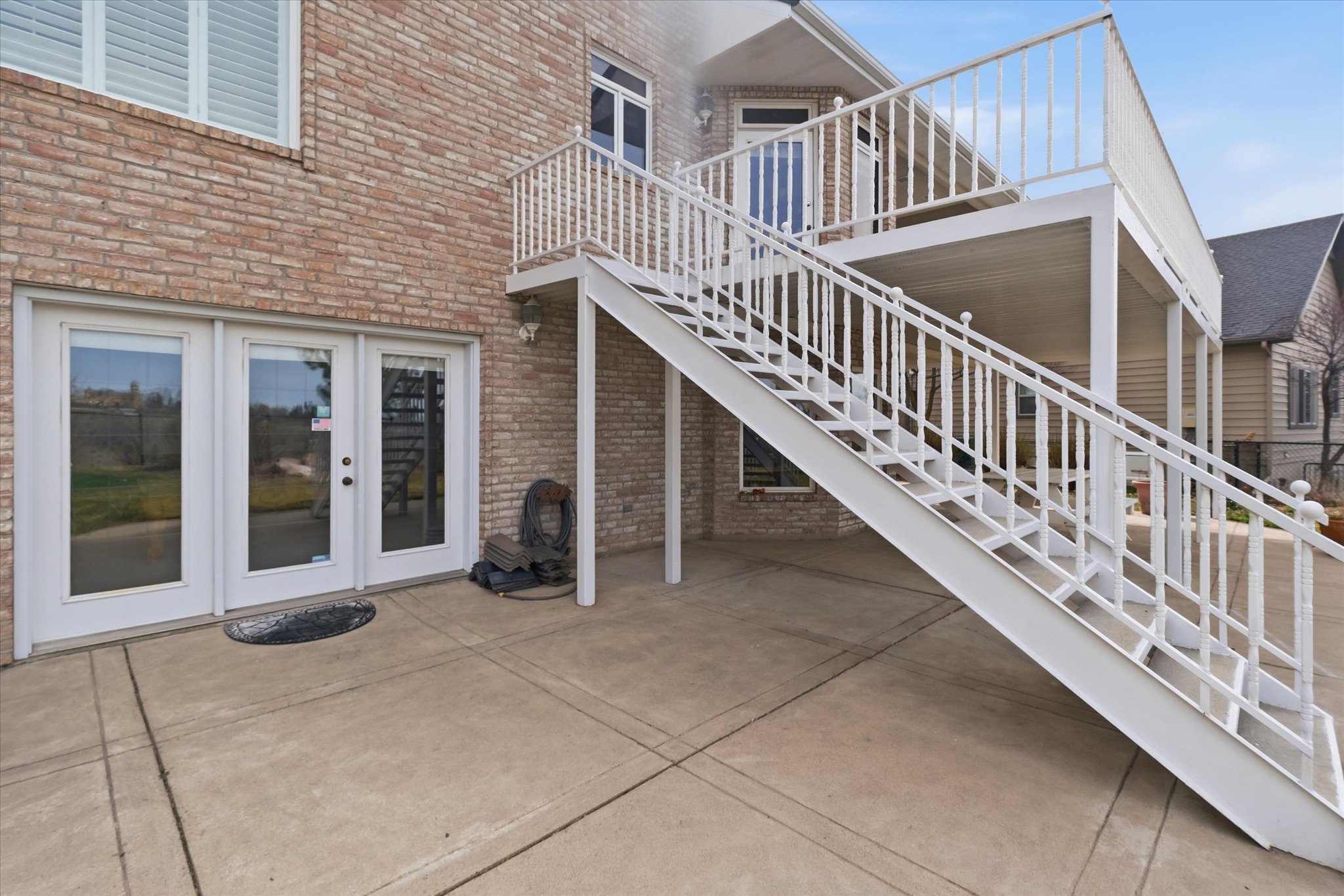 View of patio featuring stairway and french doors