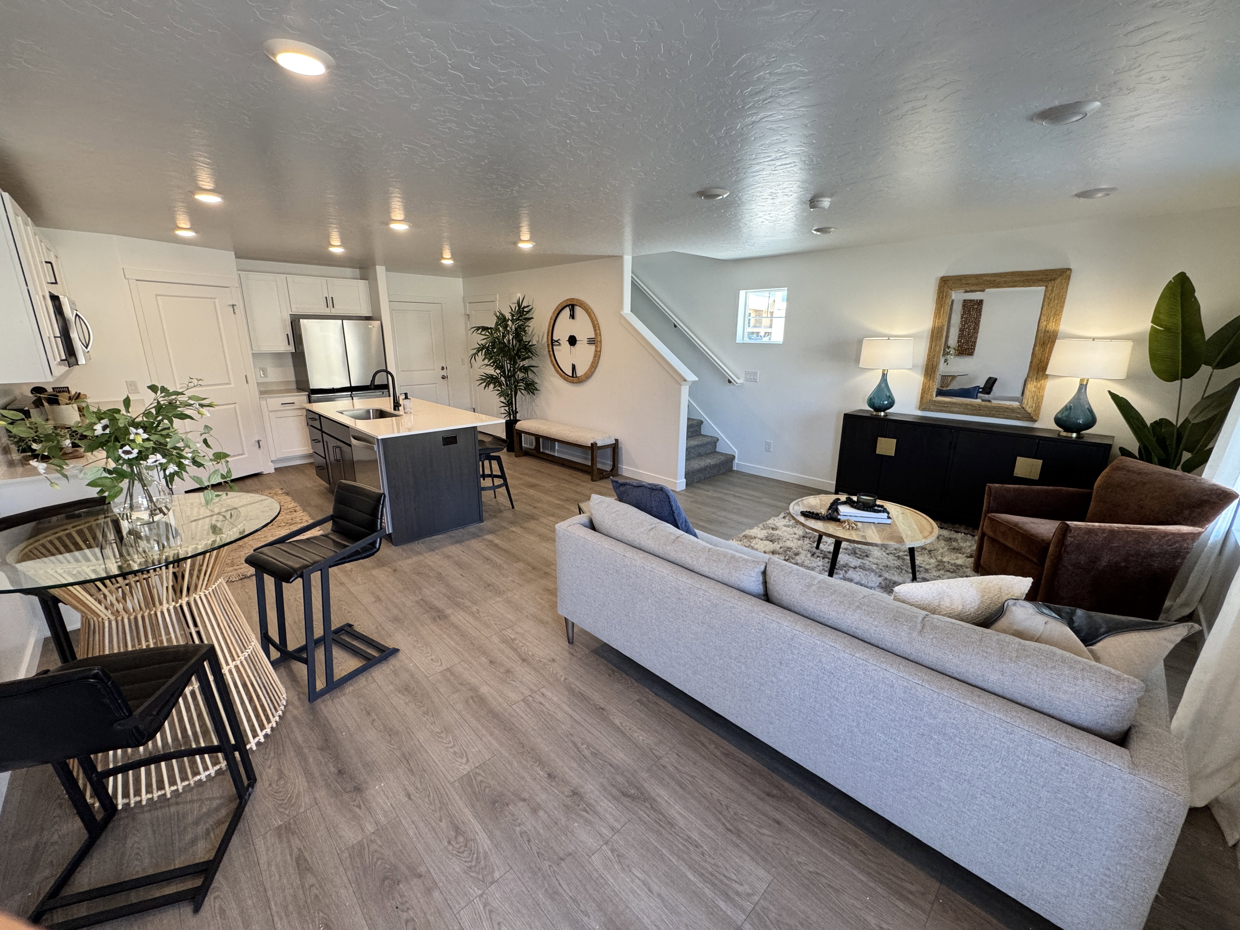 Open-concept living space featuring wood-finish flooring