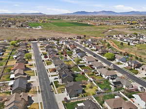 View of property location featuring nearby suburban area and a mountainous background