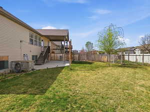 Fenced backyard featuring stairway and a patio