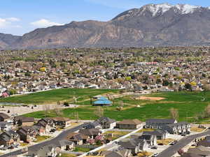 Mountain view featuring nearby suburban area and a golf club