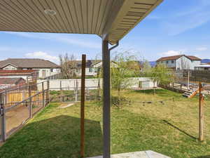 Fenced backyard with a residential view