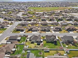 Aerial view of property's location featuring nearby suburban area