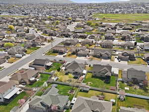 Aerial overview of property's location with nearby suburban area and a mountain backdrop