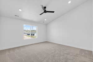 Unfurnished room featuring light carpet, ceiling fan, and recessed lighting