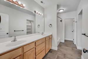 Ensuite Bath with double vanity with tub, shower, and huge walk-in closet
