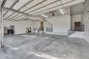 Oversized and 13.5' tall 4-Car garage with two HUGE storage rooms and EV Charger