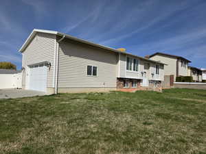View of front facade featuring a gate, driveway, and a chimney