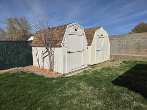 View of shed with a fenced backyard