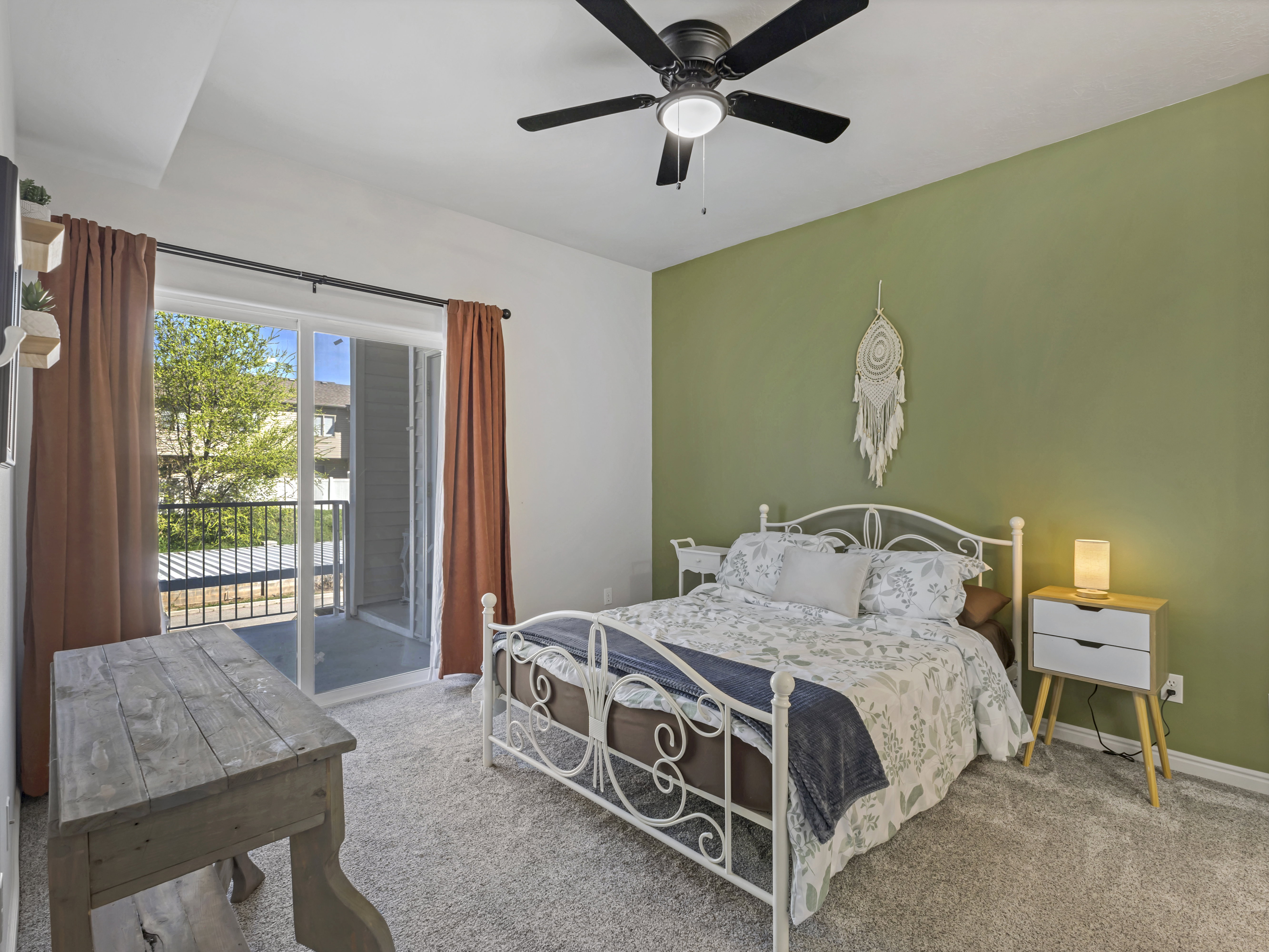 Bedroom featuring access to exterior, light carpet, and ceiling fan