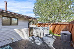 View of patio / terrace with a hot tub