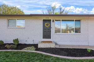 Property entrance with brick siding