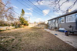 Fenced backyard with a patio area