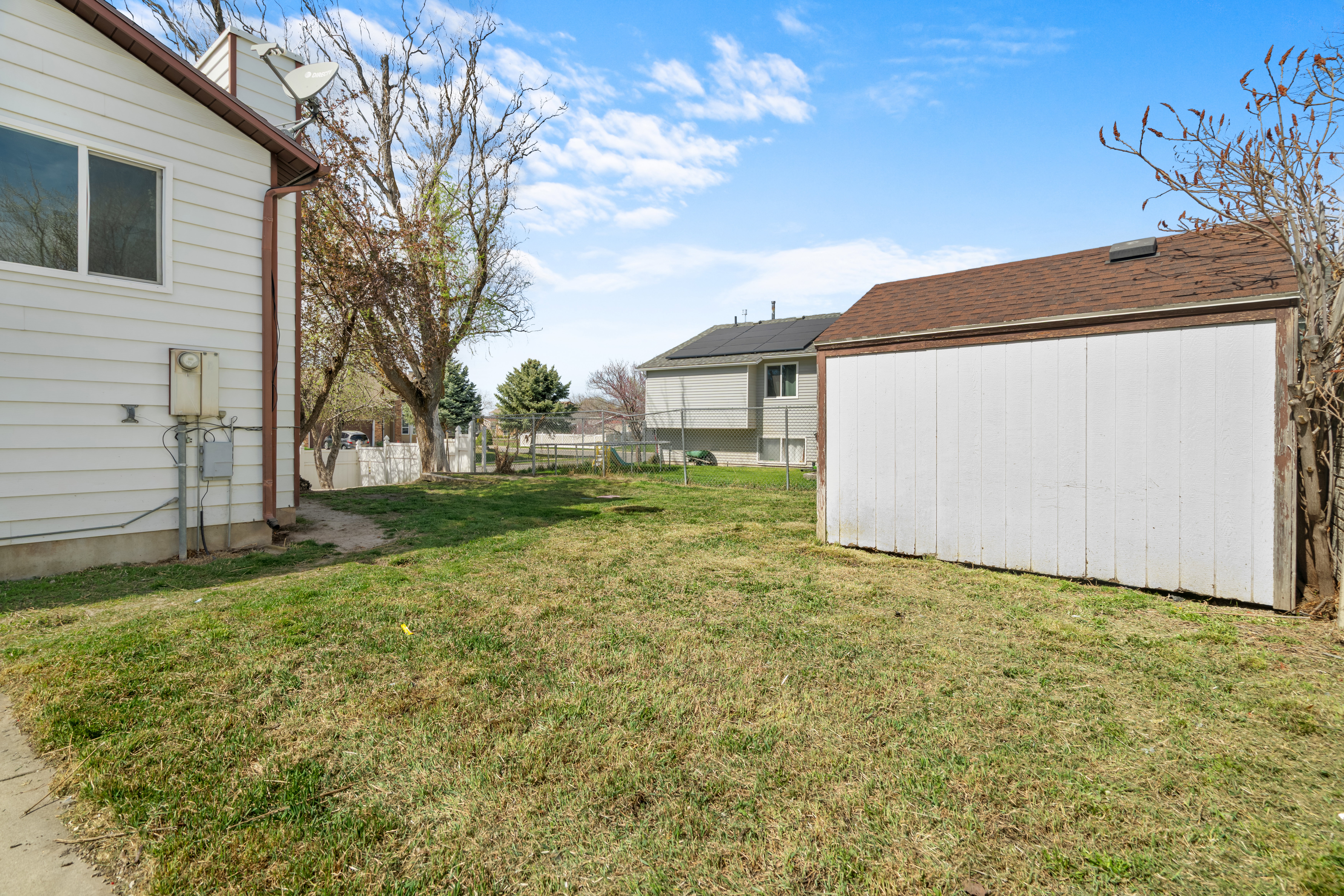 View of yard featuring a storage unit