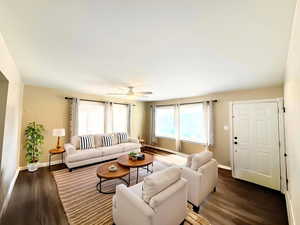 Living area featuring LVP wood finished floors, healthy amount of natural light, and a ceiling fan - Enhanced photo staged