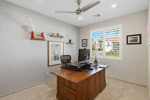 Office featuring light colored carpet, a ceiling fan, and recessed lighting