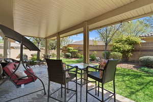 Fenced backyard featuring a patio and outdoor dining space