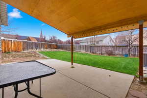 Fenced backyard featuring a patio area
