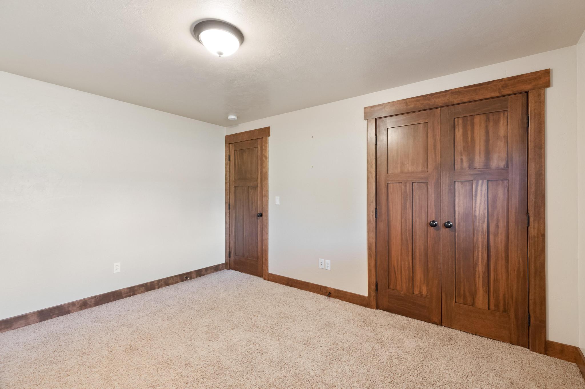Unfurnished bedroom featuring a closet and carpet