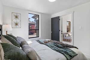 Bedroom with multiple windows