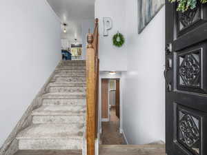 Stairs featuring baseboards