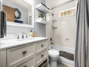 Bathroom with vanity and shower / bath combo