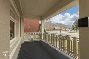Covered porch with a mountain view