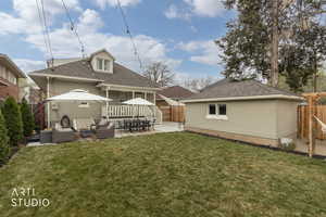Rear view of house with a gazebo, an outdoor living space, roof with shingles, a patio area, and a fenced backyard