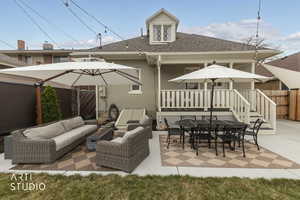 Fenced backyard featuring a patio, an outdoor living / dining area, and a gazebo