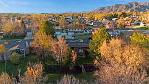 Aerial view of residential area featuring a mountainous background