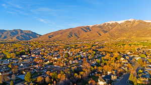 View of mountain background featuring nearby suburban area