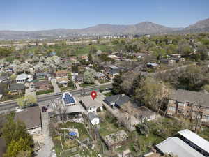 Aerial overview of property's location featuring nearby suburban area and mountains