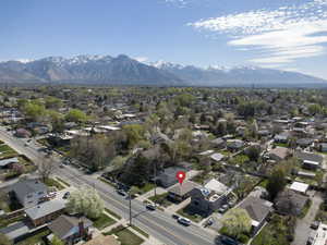Aerial view of residential area featuring a mountain backdrop