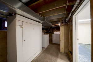 Unfinished below grade area with washer and dryer