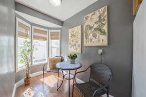 Dining area featuring baseboards and hardwood / wood-style flooring